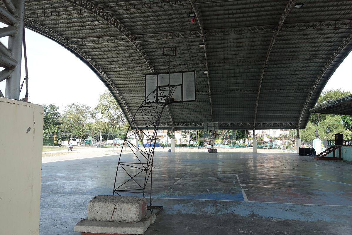 Inside (or underneath) the sheltered basketball court of Banga Municipal Park, commonly called "The Plaza", between Quezon Avenue and Roxas Street in Banga, South Cotabato, Philipp