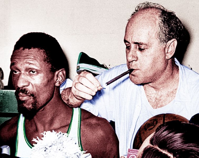 Boston Celtics center Bill Russell next to head coach Red Auerbach after winning the 1966 NBA Finals.