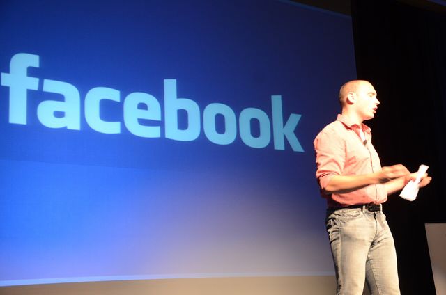 A picture of the Chief Marketing Officer and VP of Analytics for Facebook Alex Schultz that shows Facebook on smartphones having a big impact on the expansion of sports journalism 