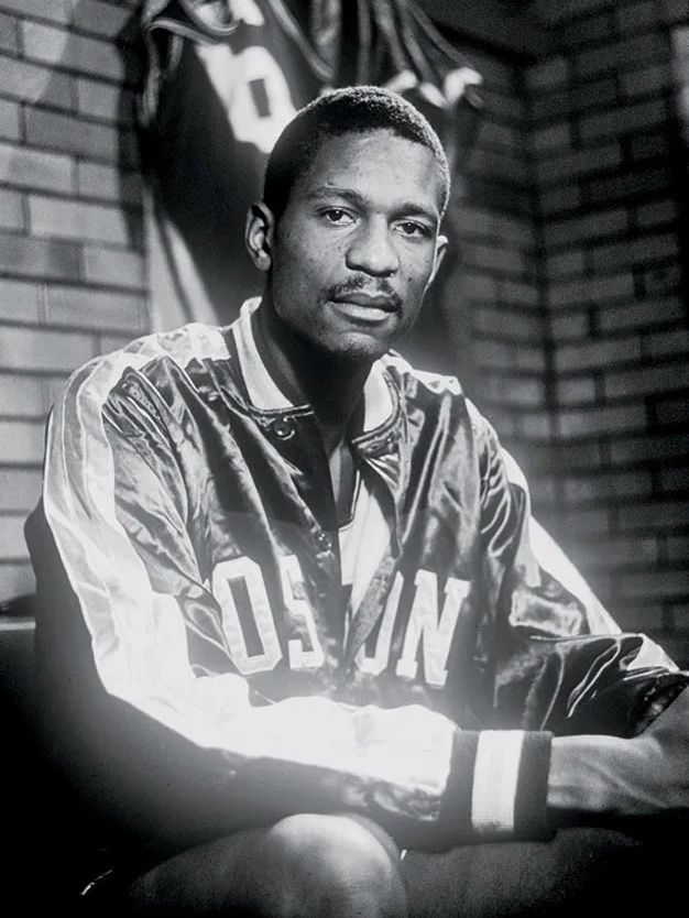 Bill Russell wearing a Boston Celtics jacket in 1957