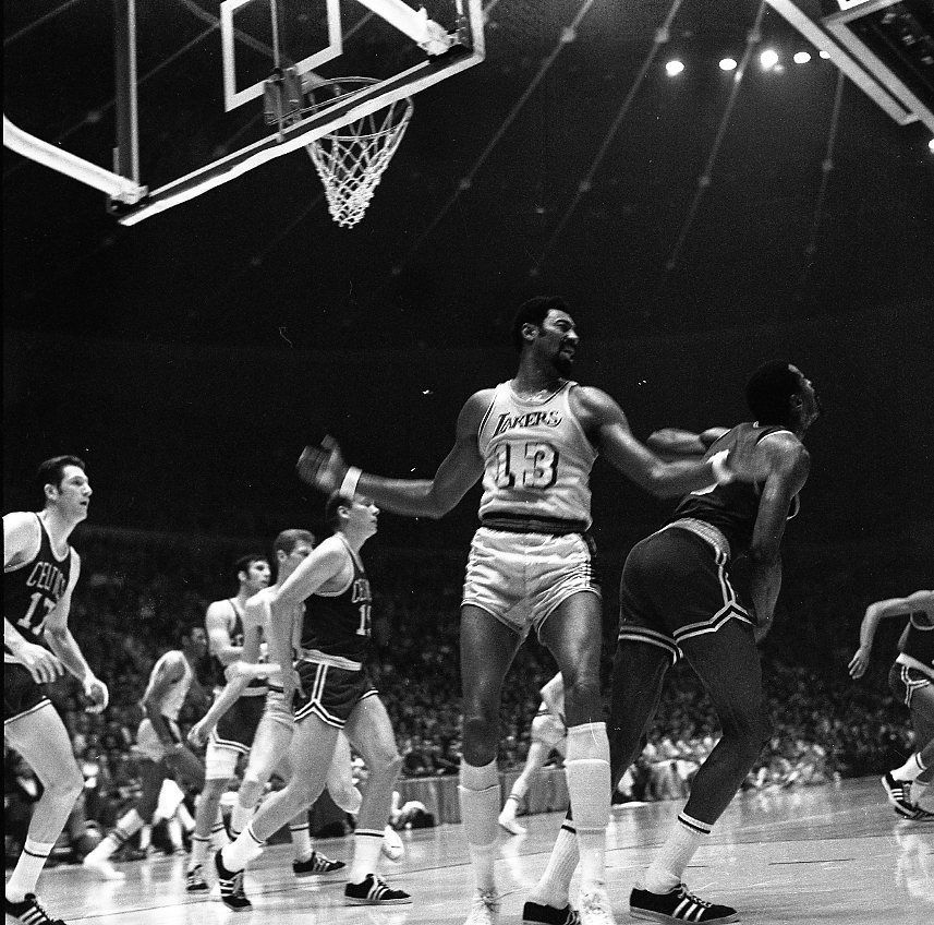 Wilt Chamberlain (#13) playing for Los Angeles Lakers in the 1969 NBA finals v Boston Celtics. In this picture (foreground: Wilt Chamberlain (13). From left to right, of the Boston