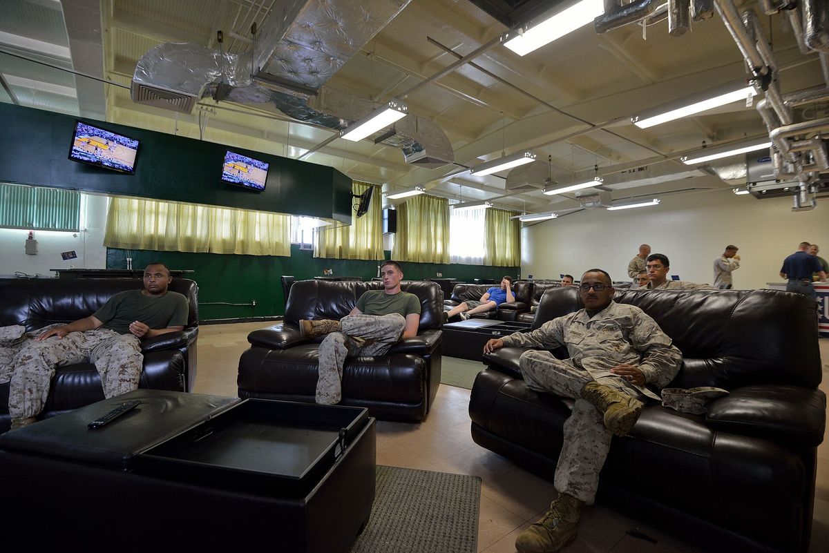 Marines and sailors watch game seven of the National Basketball Association finals June 21 at the recently opened sports lounge at the Camp Schwab USO center. The new addition to t